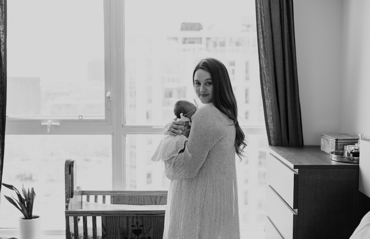 Madison Schumann, founder of Fourth, holding her newborn